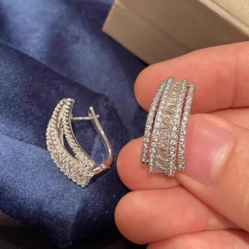 Geometric stud earrings with white gold colour finish and zircon inlaid decoration