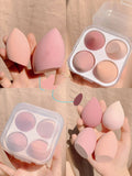 Four synthetic makeup sponges in grape, mango, mint, and peach colours, each measuring 6cm