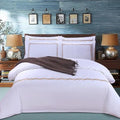 Four-piece cotton bedding set in plain colour with twill weave and reactive print