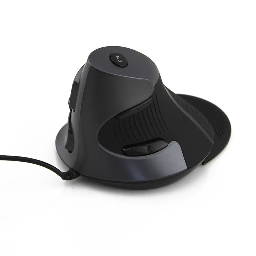 Black and white wired vertical ergonomic mouse for desktop computers on a wooden desk.