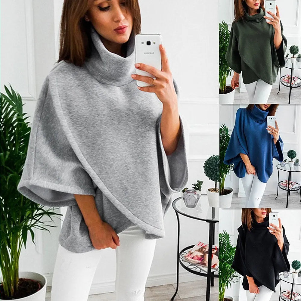 Long grey women's cardigan with batwing sleeves and three-button placket.