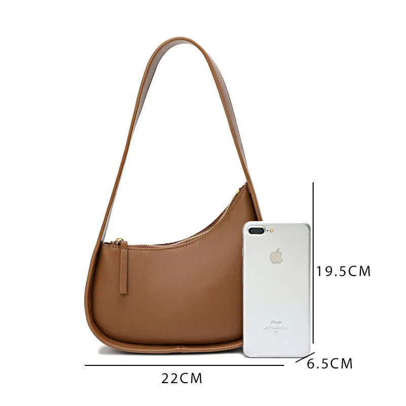 Genuine leather ladies shoulder bag in half moon shape with wide strap