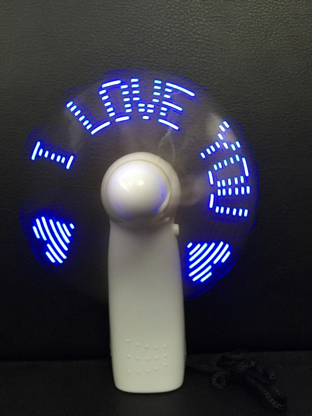 White handheld mini fan with LED love pattern display in blue and red colours