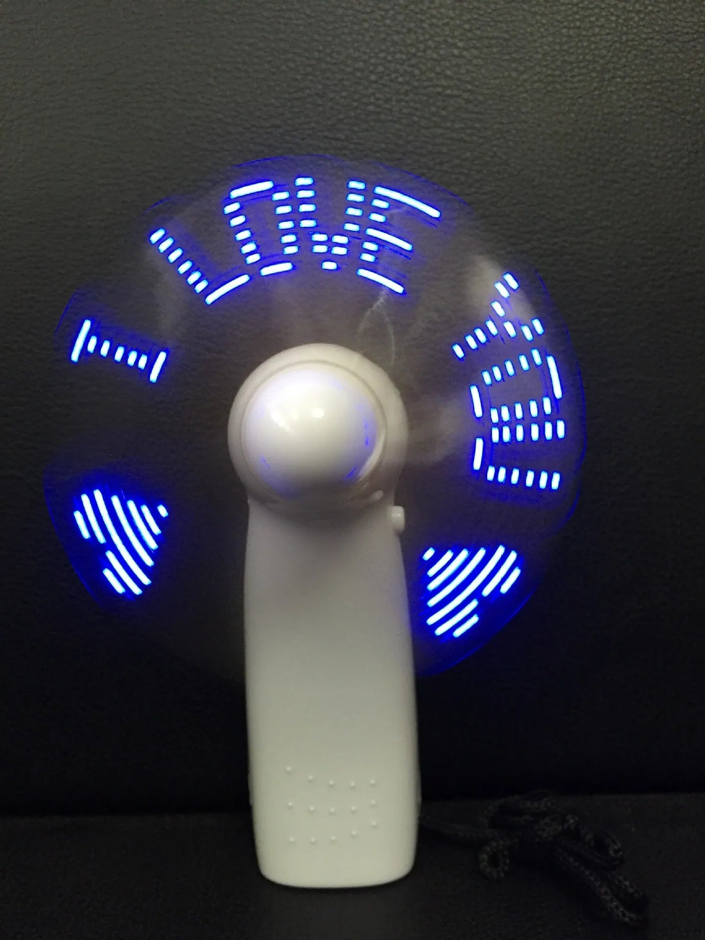White handheld mini fan with LED love pattern display in blue and red colours