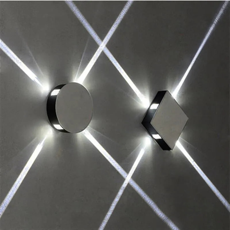Modern square aluminium and iron LED wall light with warm white glow on a wall