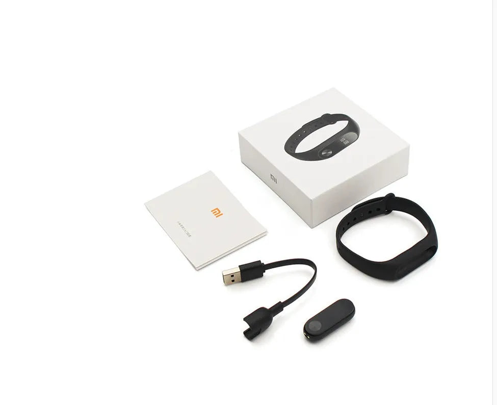 Xiaomi Mi Band 2 black fitness tracker with OLED screen on an adjustable thermoplastic elastomer wrist strap.