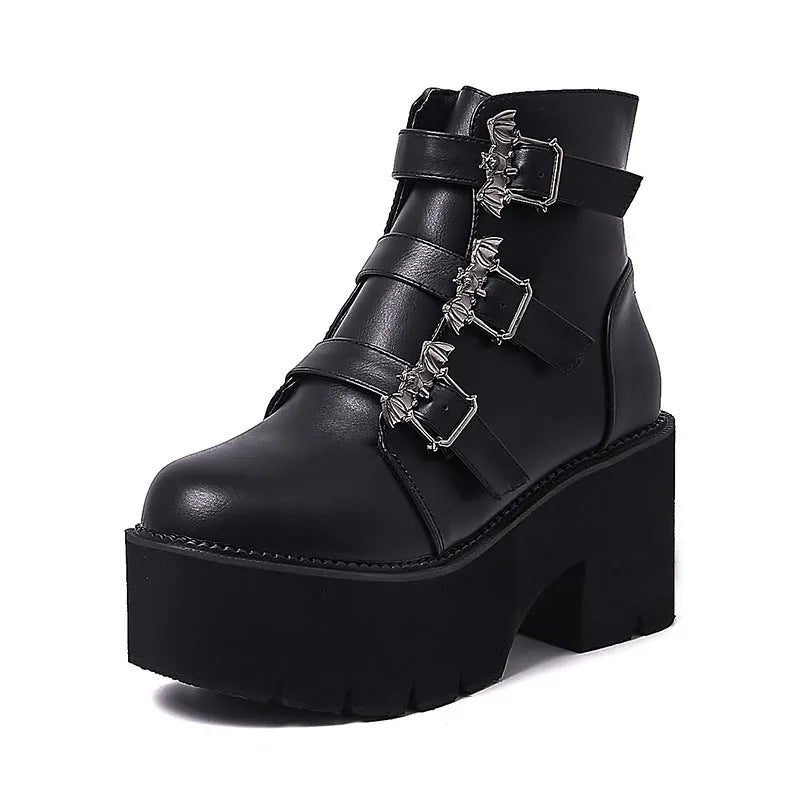 Black women's punk ankle boots with bat buckle decoration and side zip closure