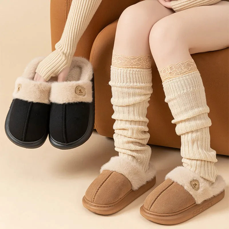 Plush winter slippers with thick PVC sole and fleece upper in various colours