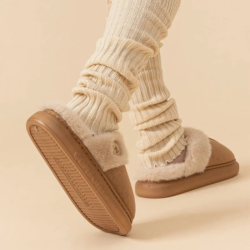 Plush winter slippers with thick PVC sole and fleece upper in various colours