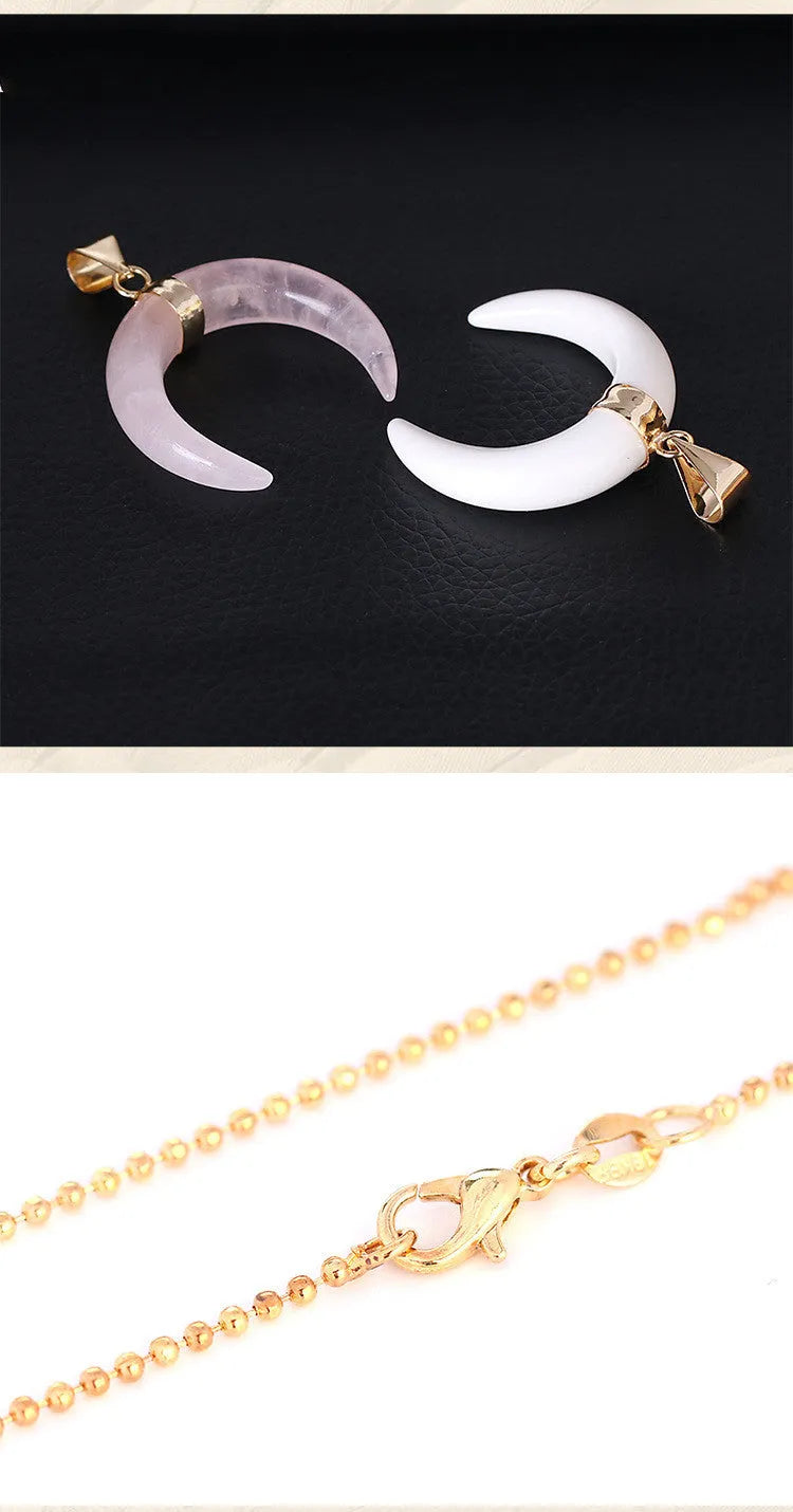 Close-up of a moon-shaped pendant necklace made from pink natural crystal stone on a 45cm electroplated copper chain.