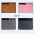 Wireless charging mouse pad with phone holder in four colour options on a desk