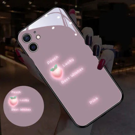 White Apple iPhone case with painted daisy pattern and illuminated voice-activated colour light on display.
