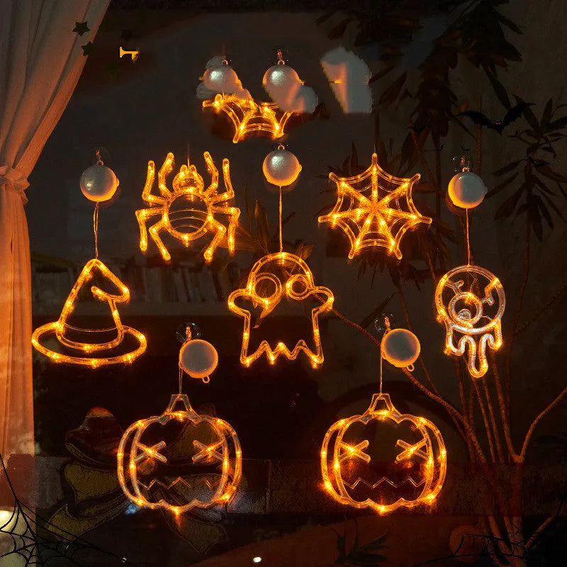 Set of seven Halloween LED hanging lights with spider, pumpkin, and ghost designs for window decoration