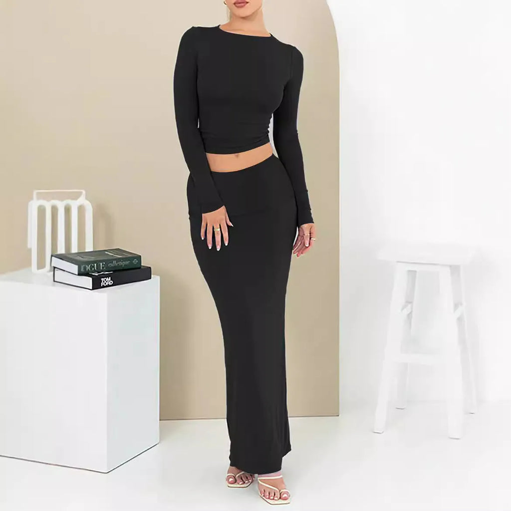 Women's black polyester two-piece autumn suit with sweet style, three-quarter sleeves, and long skirt.