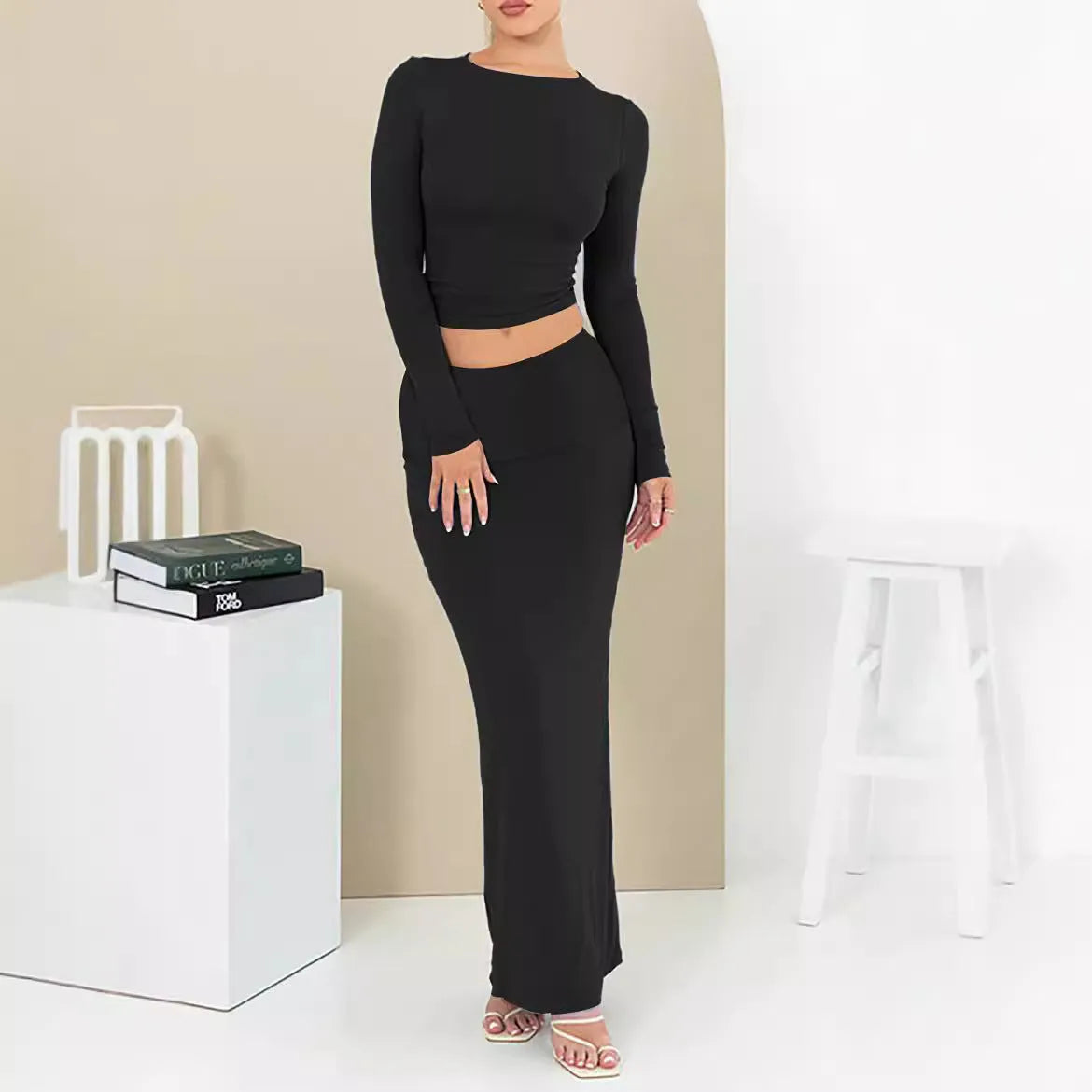 Women's black polyester two-piece autumn suit with sweet style, three-quarter sleeves, and long skirt.