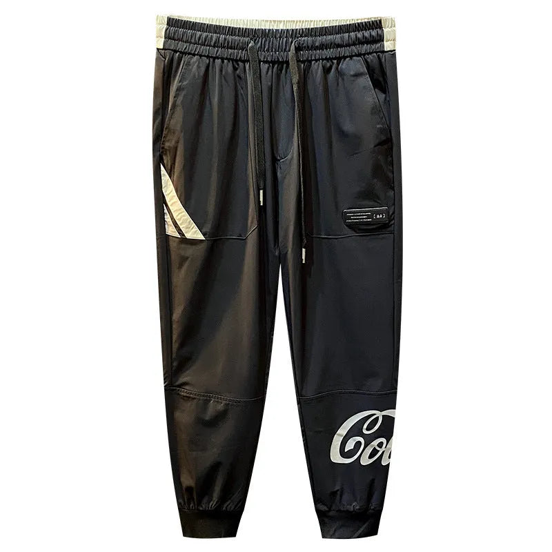 Man wearing black ultra-thin ice silk cotton ankle-banded cropped casual trousers