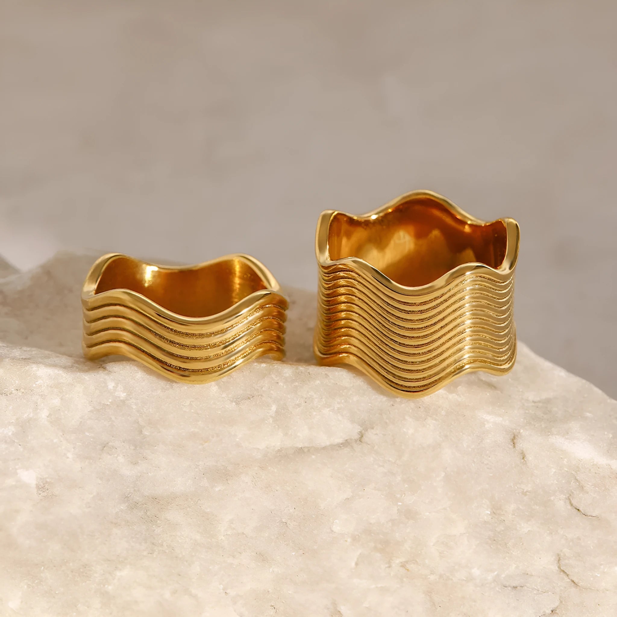 Stainless steel wide surface wave ring with geometric pattern in silver and gold tone options