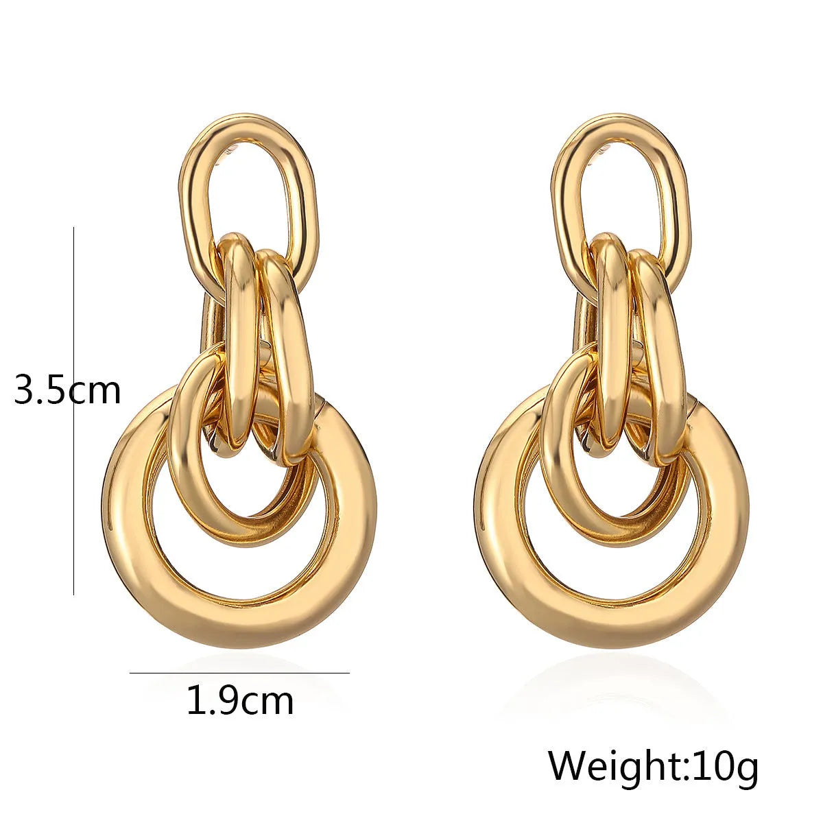 A pair of gold geometric drop earrings with an irregular asymmetric shape, made from copper.
