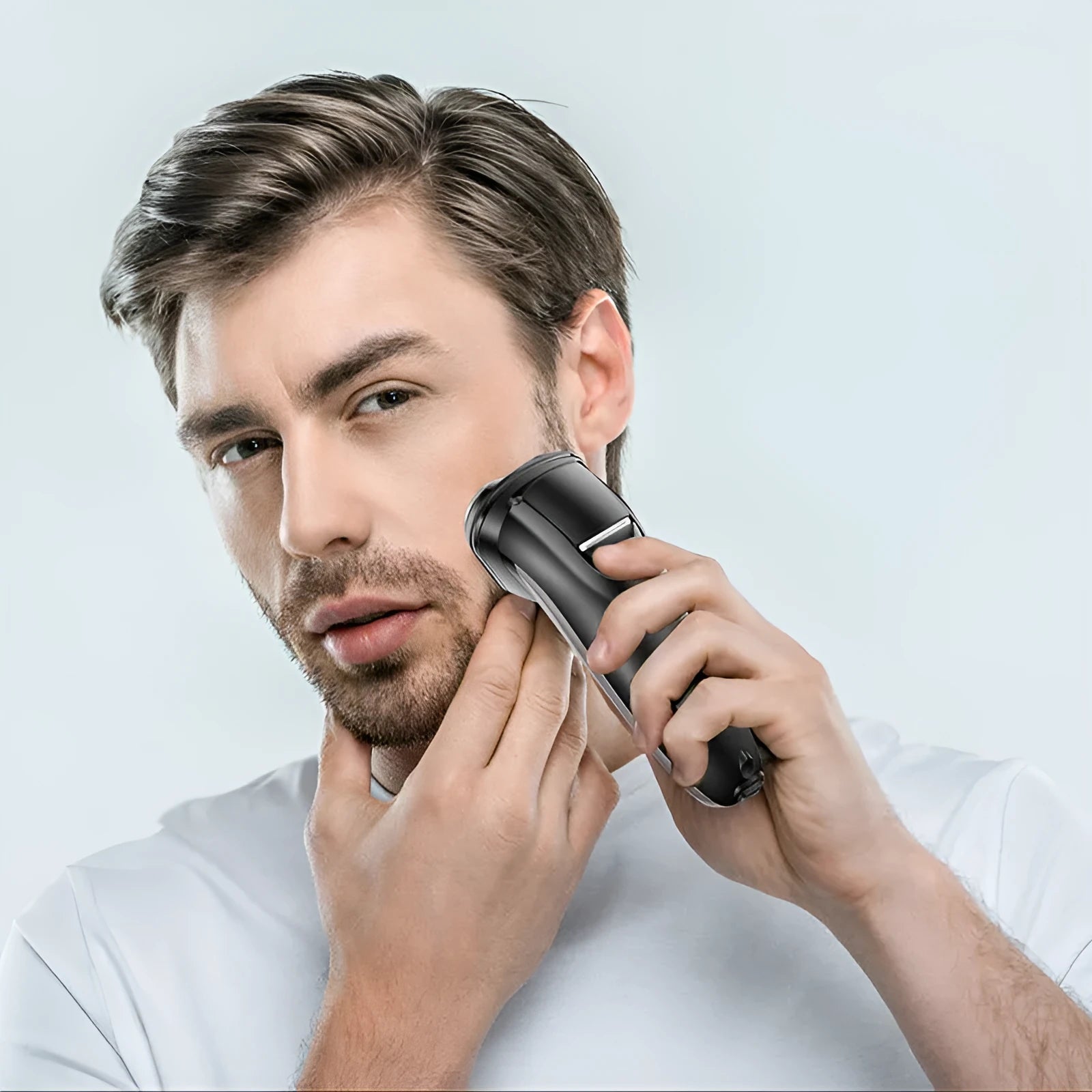 Electric shaver with three floating cutter heads and pop-up sideburn trimmer on display