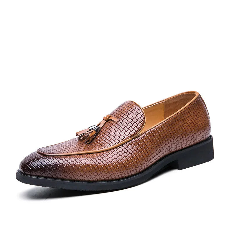 Men's black pointed toe slip on loafers with a tassel detail on the front.