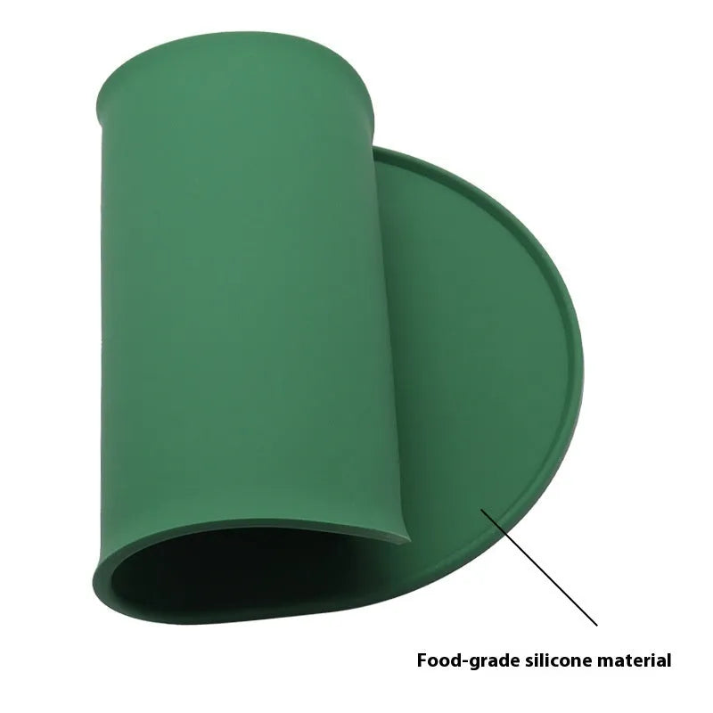 Silicone waterproof cat feeding placemat showing green colour option beneath pet food and water bowls