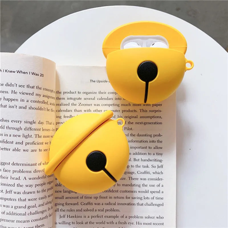 Yellow silicone bell-shaped protective case for AirPods and universal headphones.