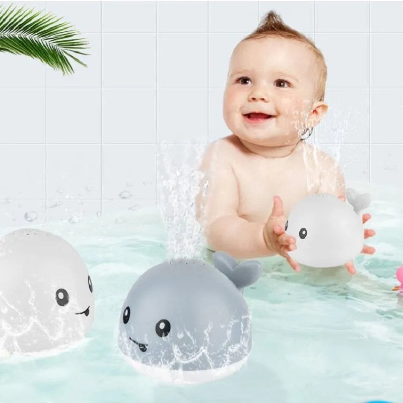 Automatic water-sensing whale spray bath toy with flashing lights for baby bath time