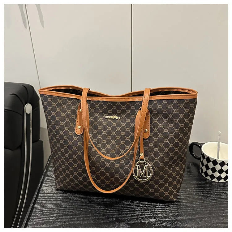 Western style black PU shoulder bag with sewing thread detailing and adjustable strap.