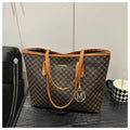 Western style black PU shoulder bag with sewing thread detailing and adjustable strap.