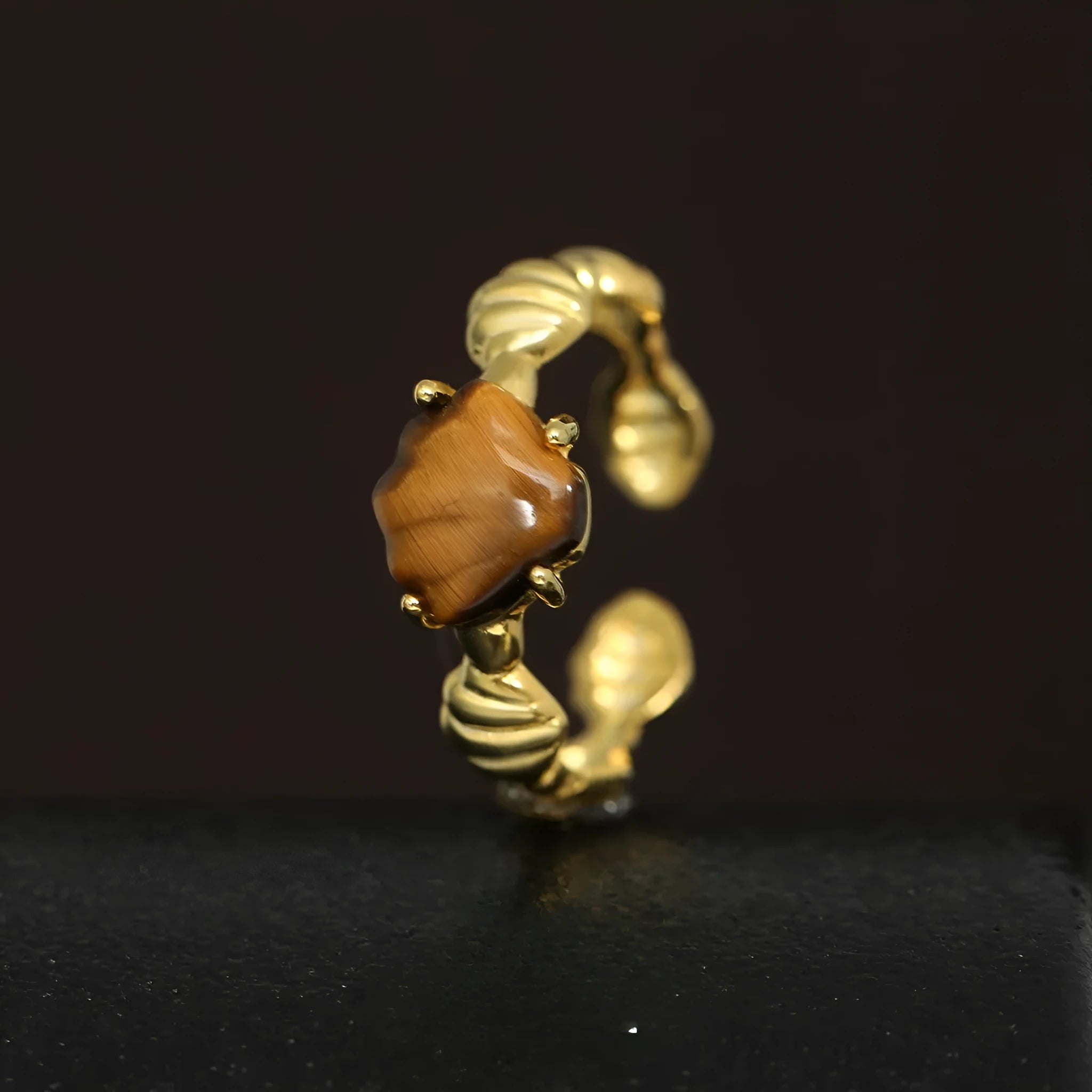 Women's adjustable silver ring with a shell design and set tiger eye gemstone in a gold colour finish.