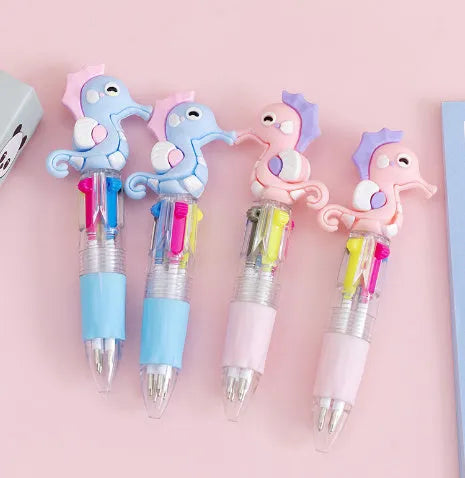 Cute cartoon-themed four-colour press-action ballpoint pen with plastic and silicone body.