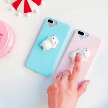 Soft silicone TPU phone case with a cute 3D cartoon cat design for iPhone, shown in pink.