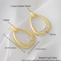 Women's yellow gold geometric drop earrings with oval rings measuring 2.6cm