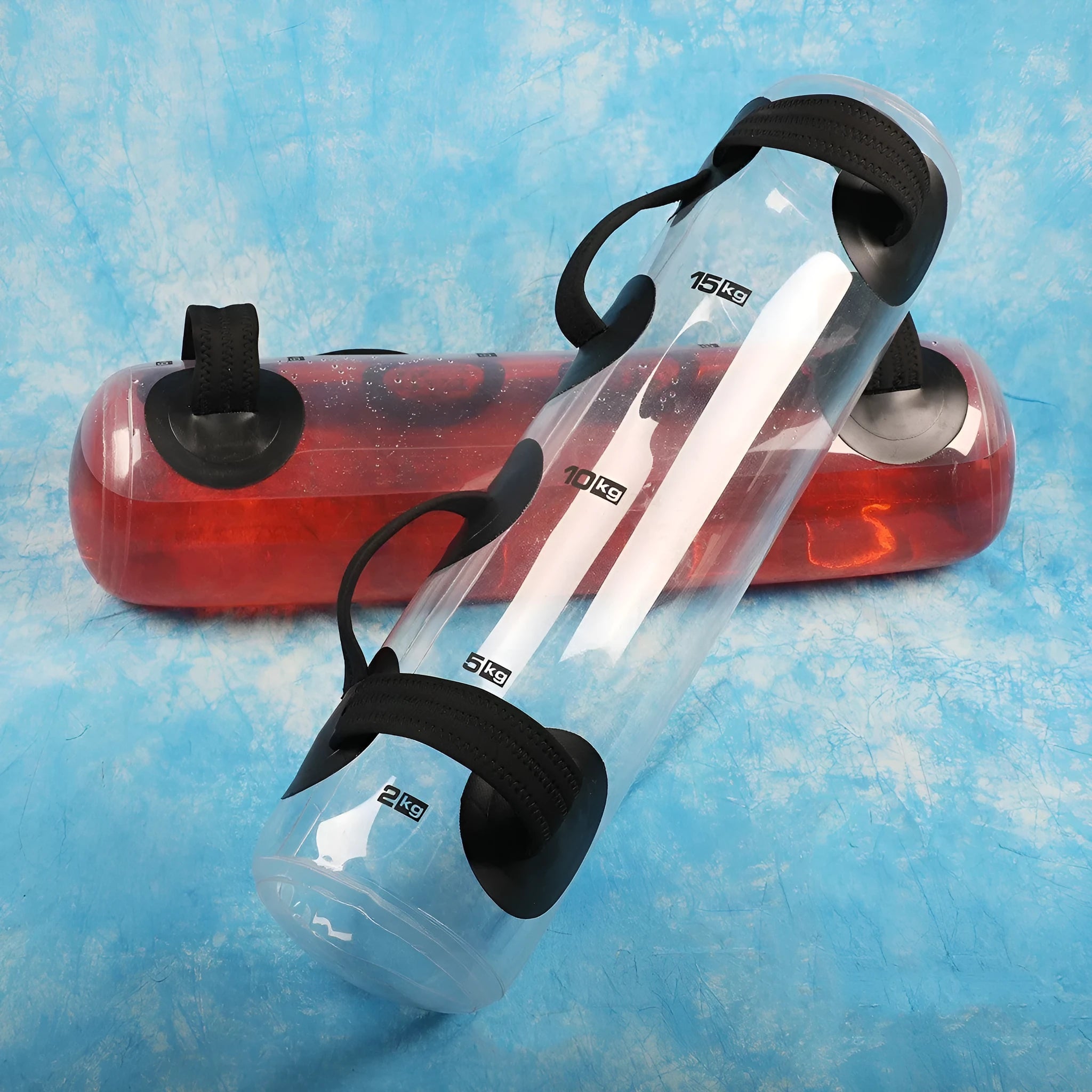 Transparent PVC inflatable weight lifting bag filled with water, showing soft dumbbell form.