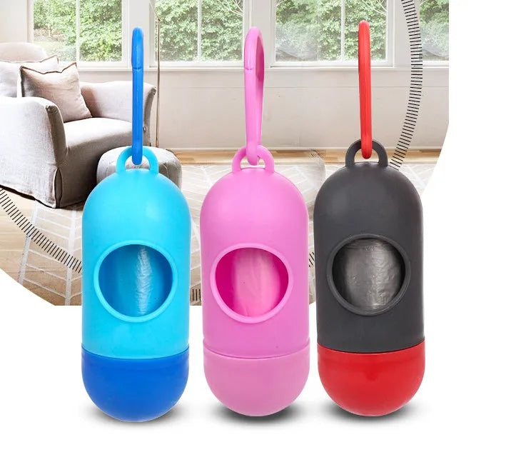 Roll of coloured dog waste bags showing black, blue, green, pink, and purple options.