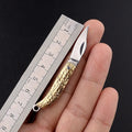 Brass mini folding knife with 3cm blade and keychain pendant on brass ring, 50mm full length model shown