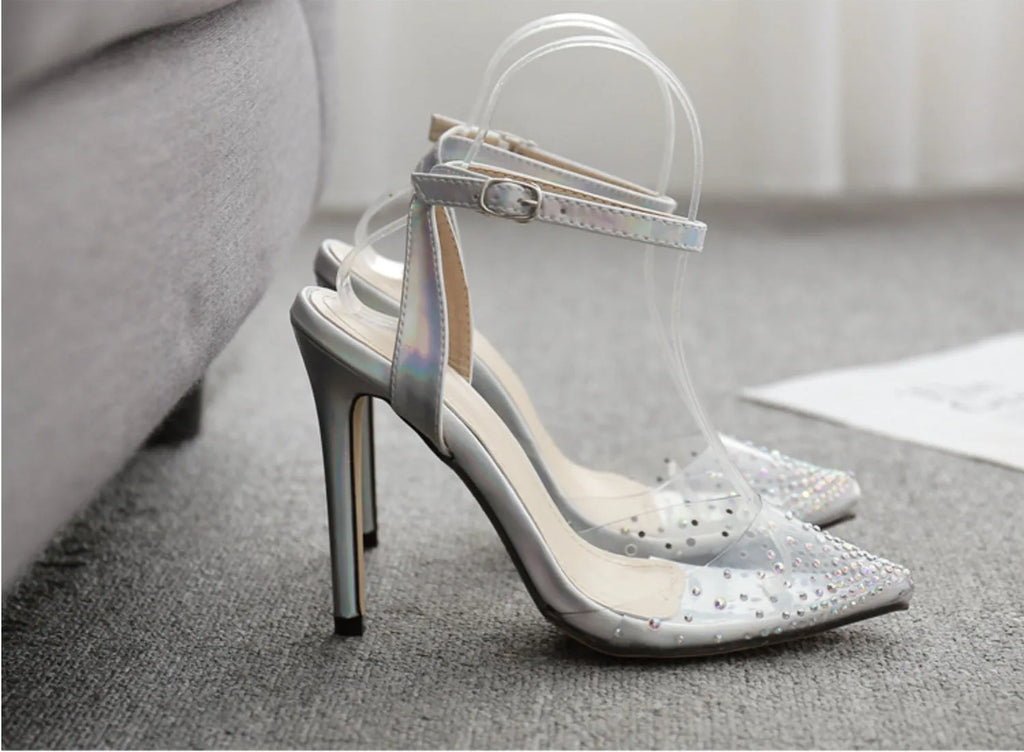 Women's pointed toe stiletto heel sandals with diamond decoration on the PVC upper.