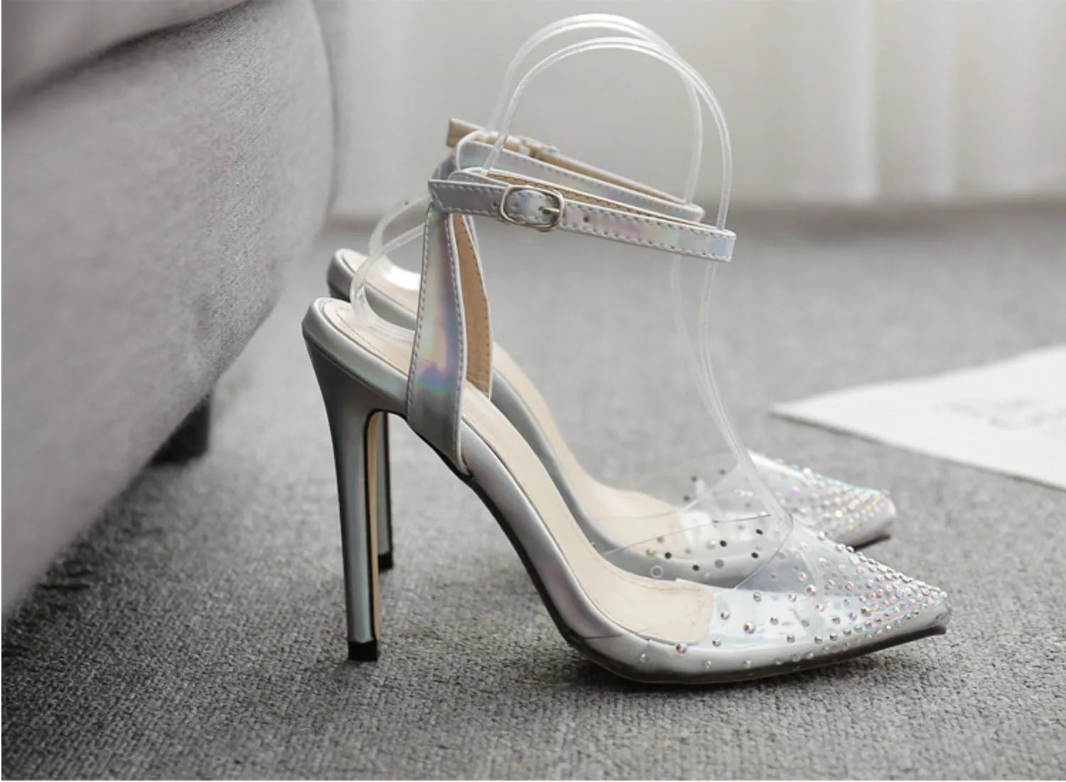 Women's pointed toe stiletto heel sandals with diamond decoration on the PVC upper.