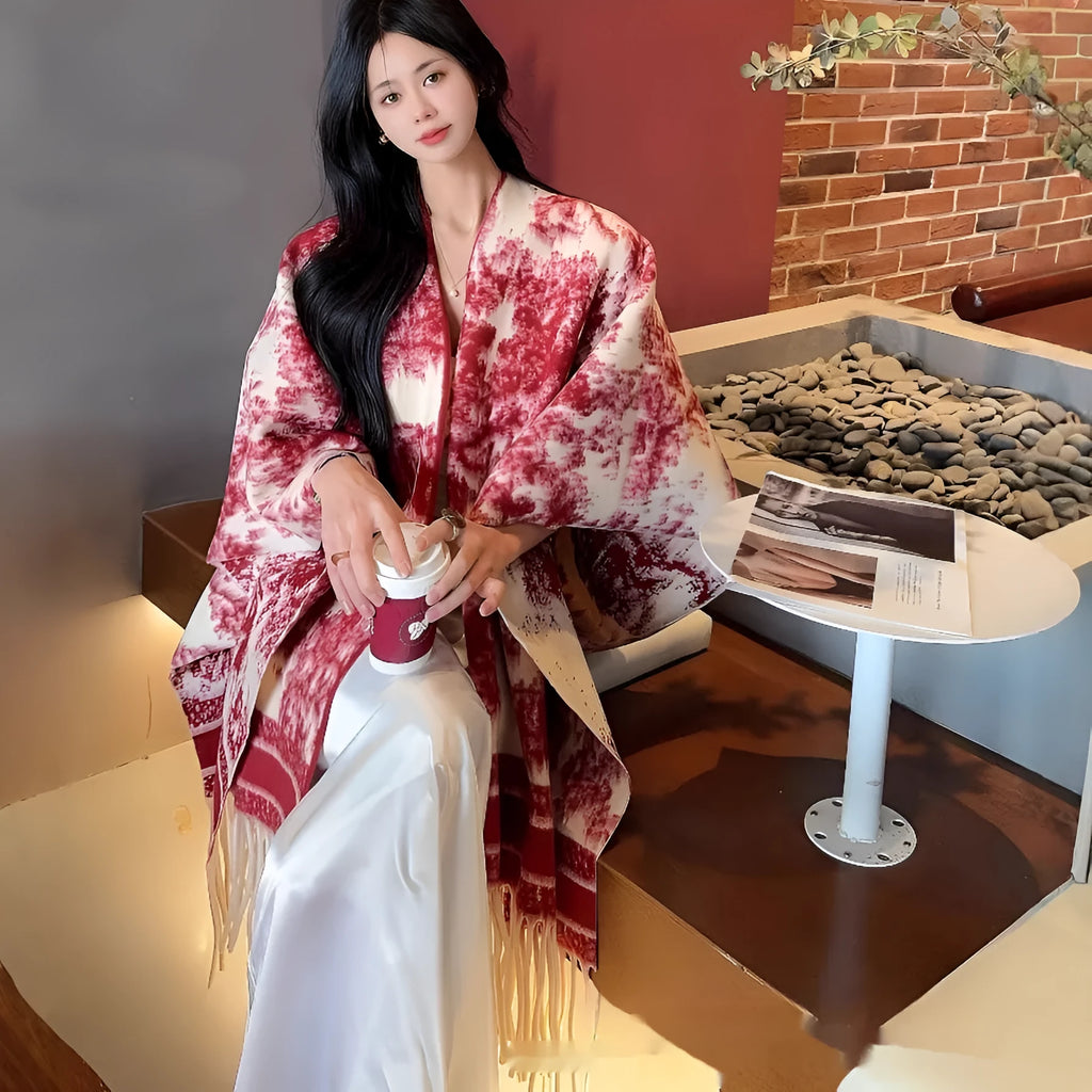 Women's fashion scarf cape with tassel detailing in polyester fabric, shown draped as a shawl