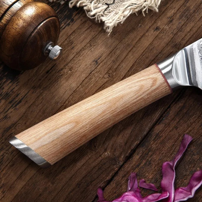 Damascus kitchen knife set with 67-layer steel blades and V gold core, 8-piece on a cutting board