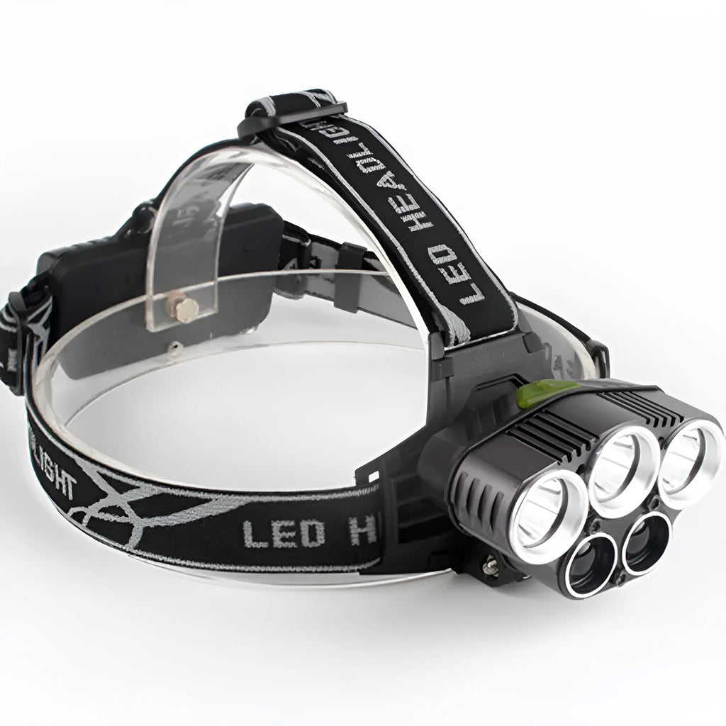 Fixed focus camping head torch with long range beam on a headband, shown with its rechargeable battery and charger.
