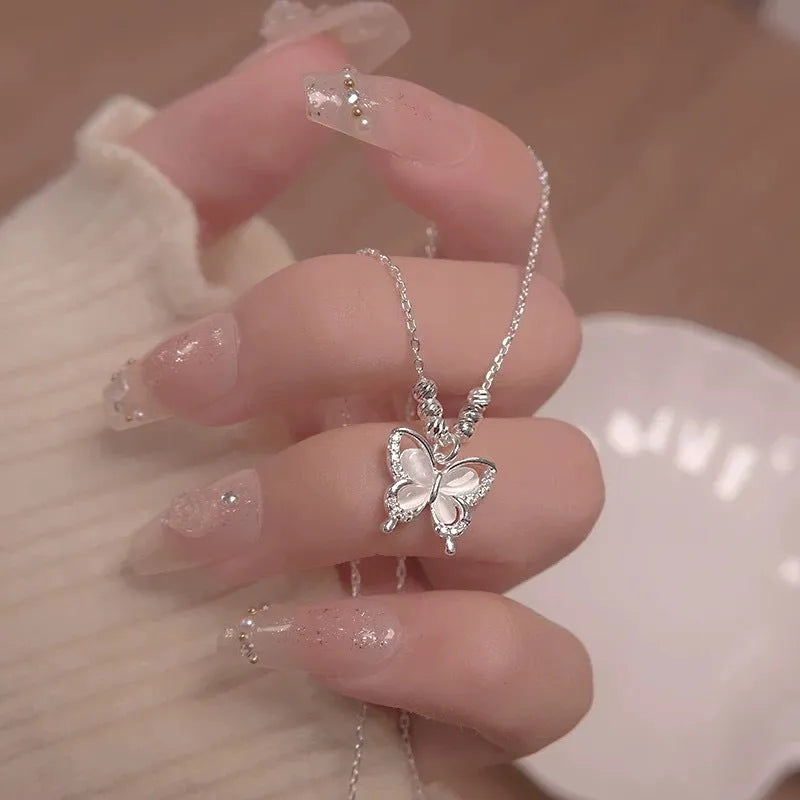 Women's silver necklace with opal butterfly charm on adjustable 925 sterling silver chain