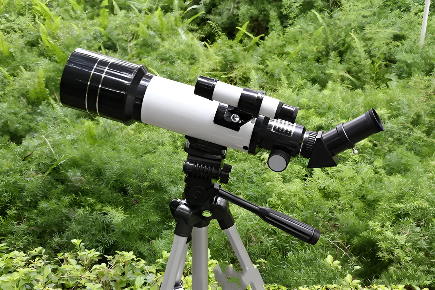 Children's dark blue astronomical telescope with tripod showing 16X-66X magnification