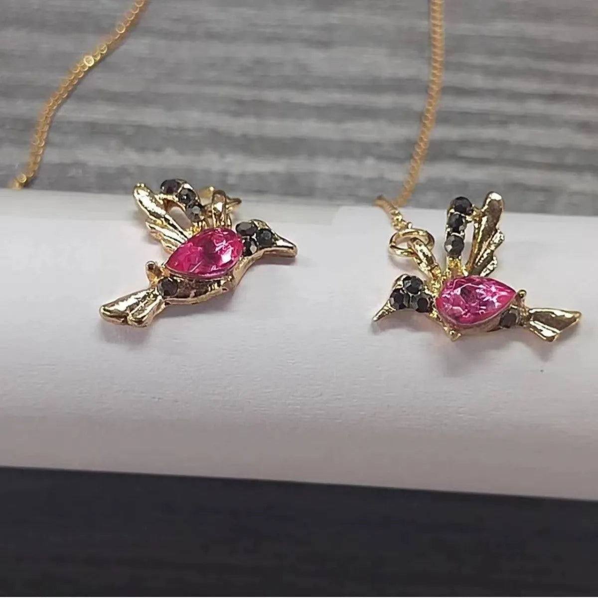 Long style women's earrings with a hanging bird design featuring mixed zirconium wings.