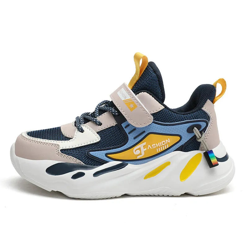 Boys' blue and black Velcro fastening sports running shoes on a white background.