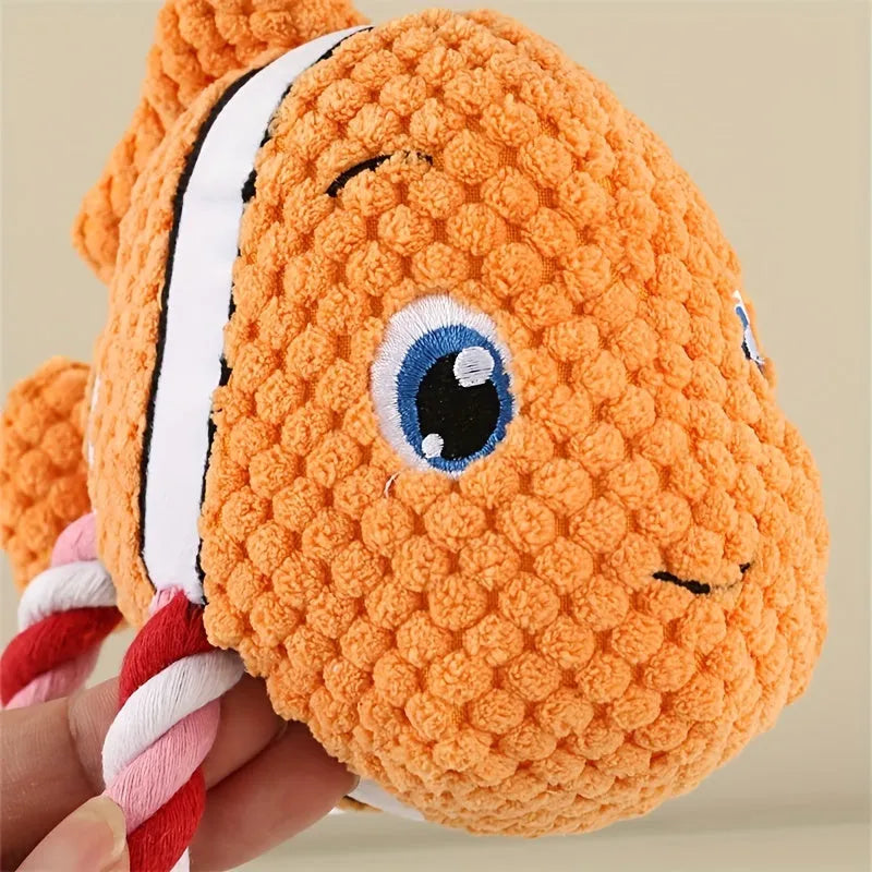 Grey turtle shaped plush dog toy with knotted rope tail and squeaker