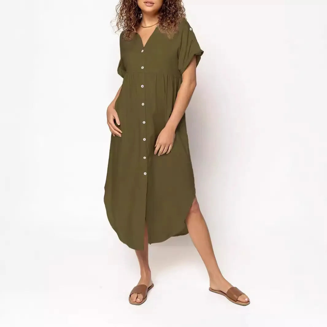 A loose-fitting, mid-length casual dress with a button-down front, shown in a solid colour.