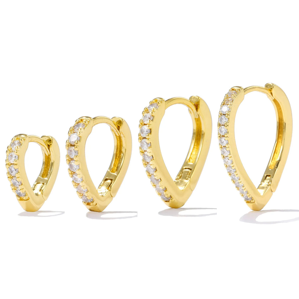 Geometric gold tone love heart clip-on earring for women on a white background.