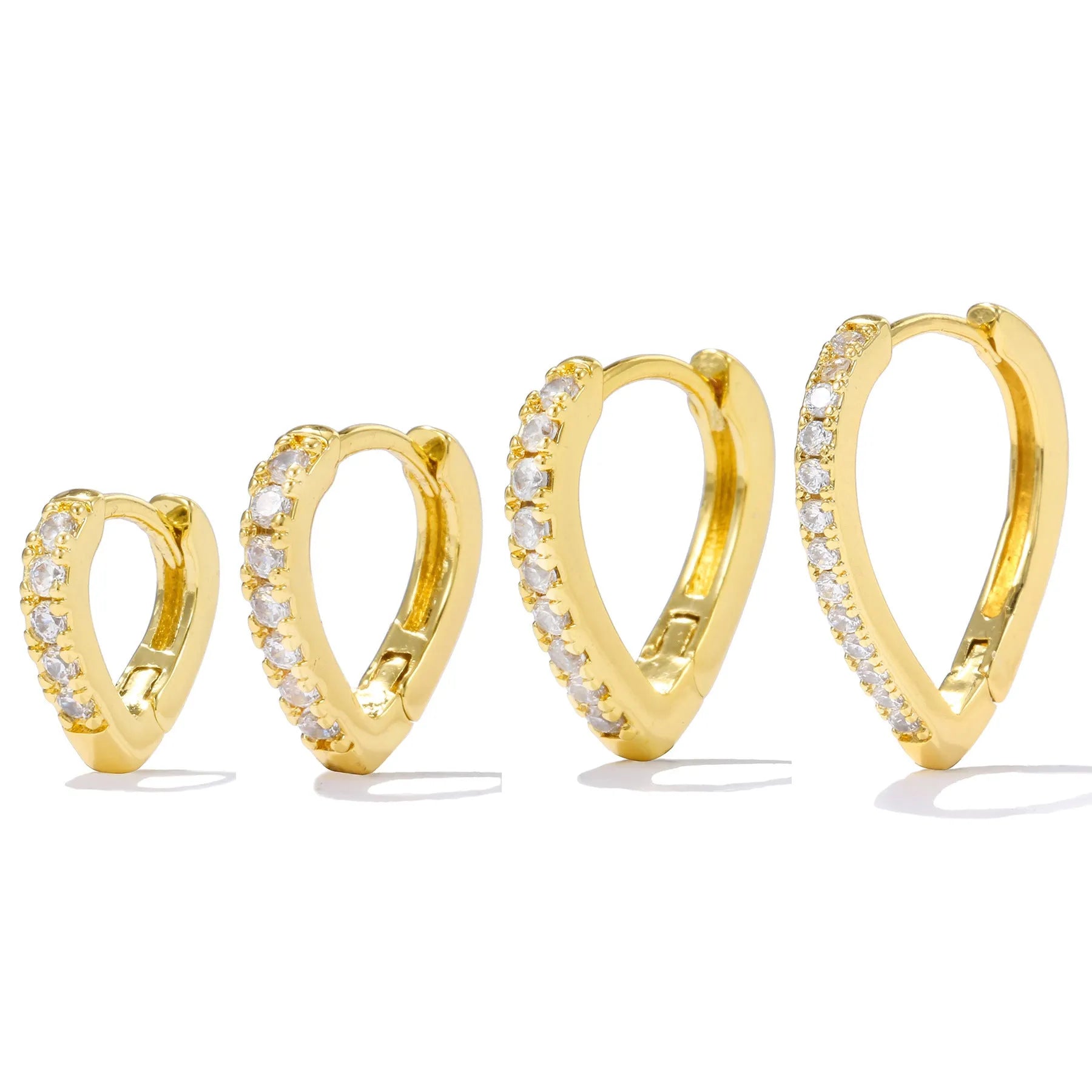 Geometric gold tone love heart clip-on earring for women on a white background.