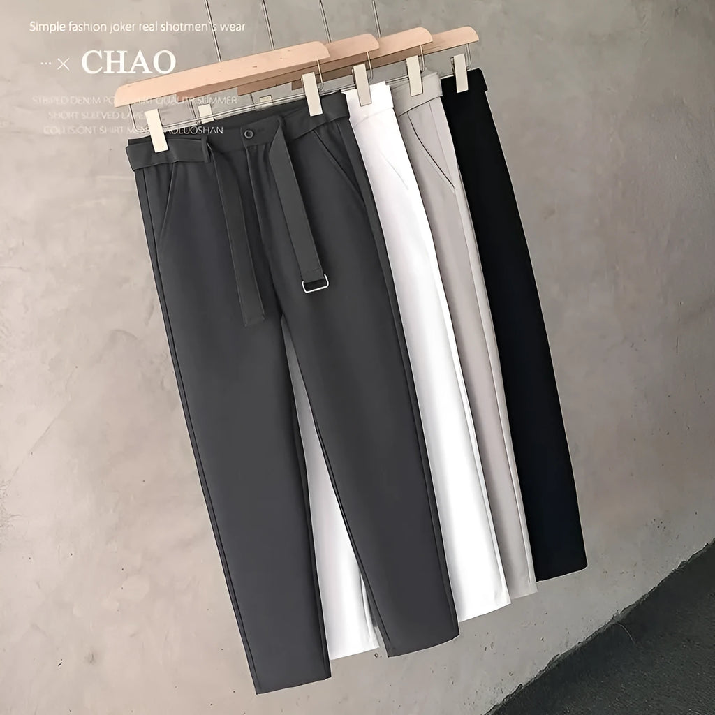 Boys slim straight wool trousers in black showing tapered cut and straight leg opening